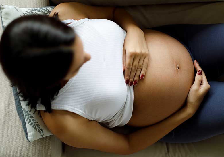 A pregnant mother reclining